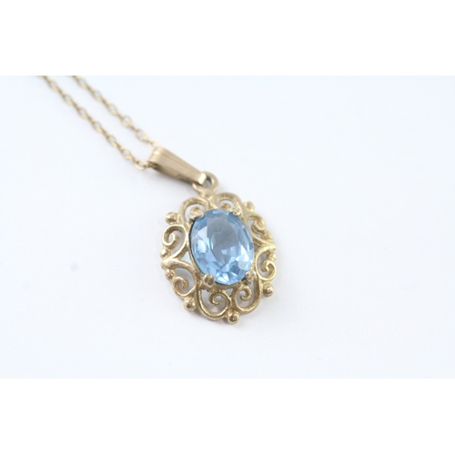 74 - 9ct gold blue gemstone ornate pendant w/ 9ct gold chain (2.4g)