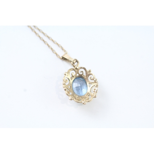 74 - 9ct gold blue gemstone ornate pendant w/ 9ct gold chain (2.4g)