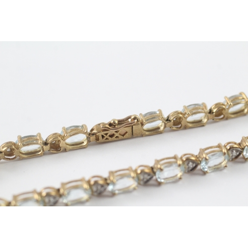 82 - 9ct gold aquamarine and diamond tennis bracelet (11g)