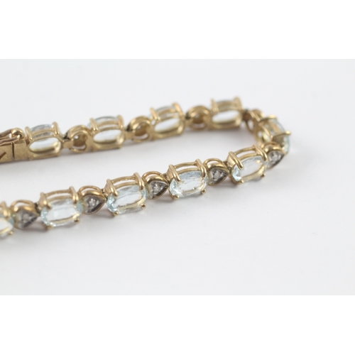 82 - 9ct gold aquamarine and diamond tennis bracelet (11g)