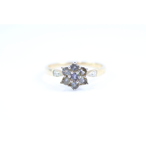 105 - 9ct gold blue gemstone and diamond floral cluster dress ring (2.3g) Size P