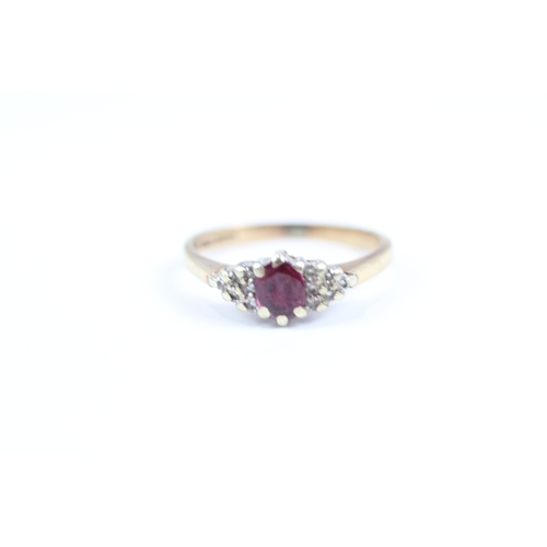 113 - 9ct gold ruby and diamond cluster dress ring (1.9g) Size J