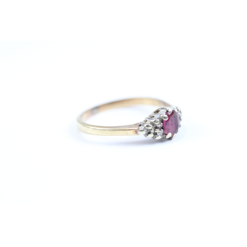 113 - 9ct gold ruby and diamond cluster dress ring (1.9g) Size J