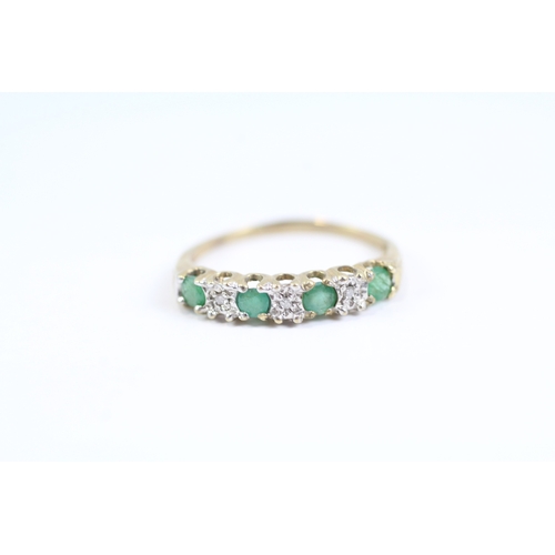 119 - 9ct gold emerald and diamond half eternity dress ring (1.3g) Size L