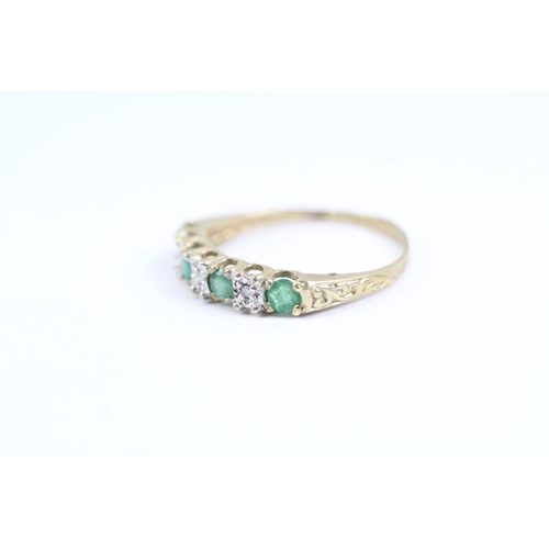 119 - 9ct gold emerald and diamond half eternity dress ring (1.3g) Size L