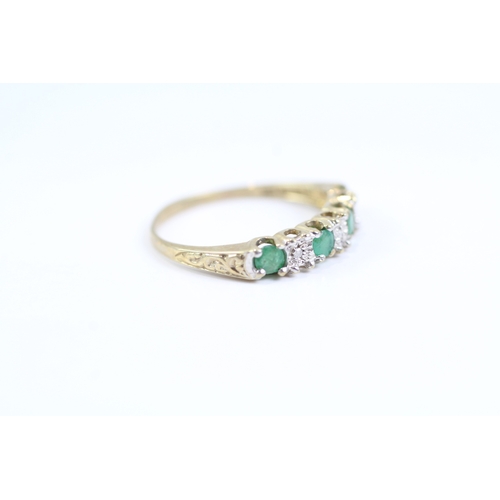 119 - 9ct gold emerald and diamond half eternity dress ring (1.3g) Size L