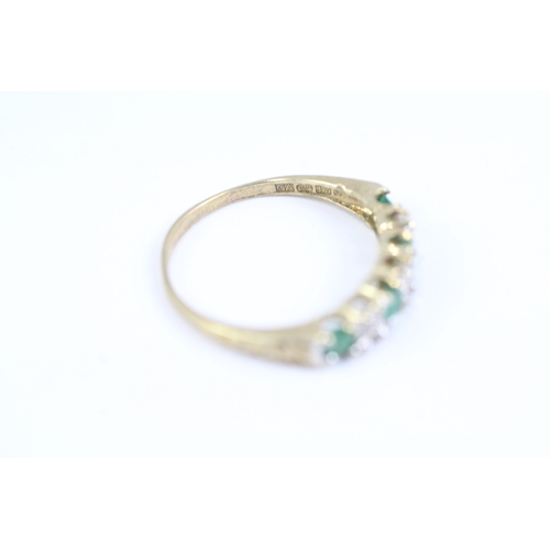 119 - 9ct gold emerald and diamond half eternity dress ring (1.3g) Size L