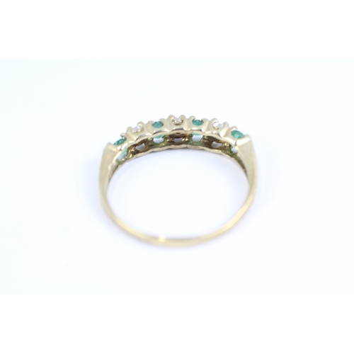 119 - 9ct gold emerald and diamond half eternity dress ring (1.3g) Size L