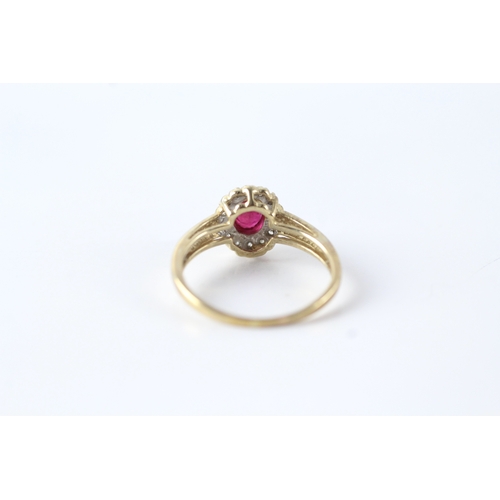 144 - 9ct gold ruby and diamond halo dress ring (1.9g) Size L 1/2