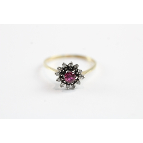 150 - 9ct gold red gemstone and diamond halo dress ring (1.9g) Size P