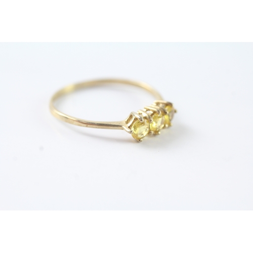 156 - 9ct gold yellow gemstone trilogy ring (1.6g) Size U 1/2