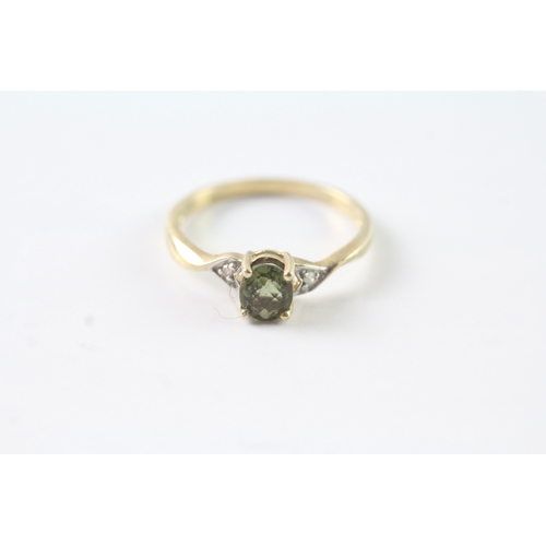 157 - 9ct gold green gemstone & diamond dress ring (1.8g) Size P