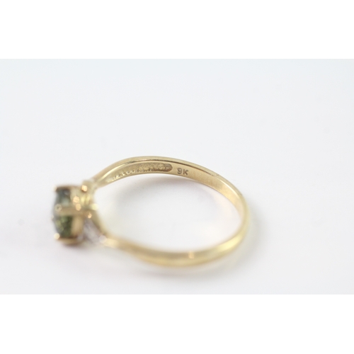 157 - 9ct gold green gemstone & diamond dress ring (1.8g) Size P