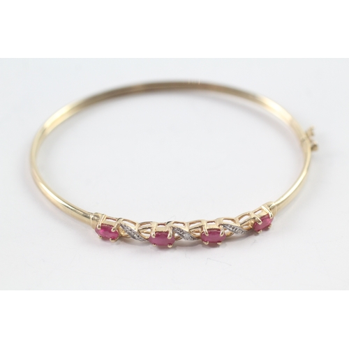 19 - 9ct gold oval cut ruby & diamond bangle (3.9g)