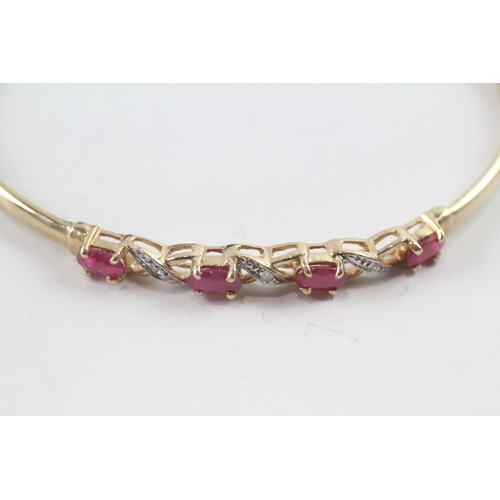 19 - 9ct gold oval cut ruby & diamond bangle (3.9g)