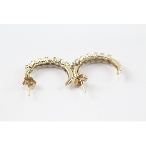 225 - 9ct gold and diamond half hoop stud earrings (1.8g)