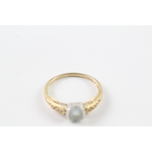 234 - 9ct gold claw set blue gemstone ring Size R