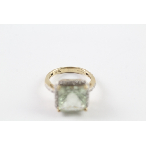 235 - 9ct gold green gemstone and diamond surround ring Size K