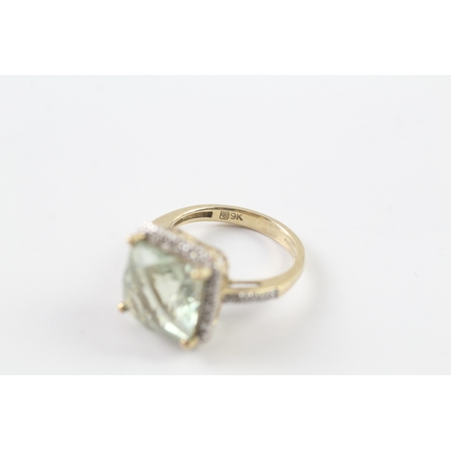 235 - 9ct gold green gemstone and diamond surround ring Size K