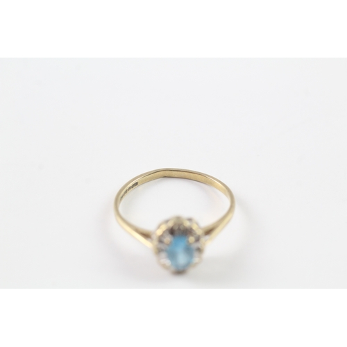 237 - 9ct gold blue gemstone and diamond halo set ring Size N