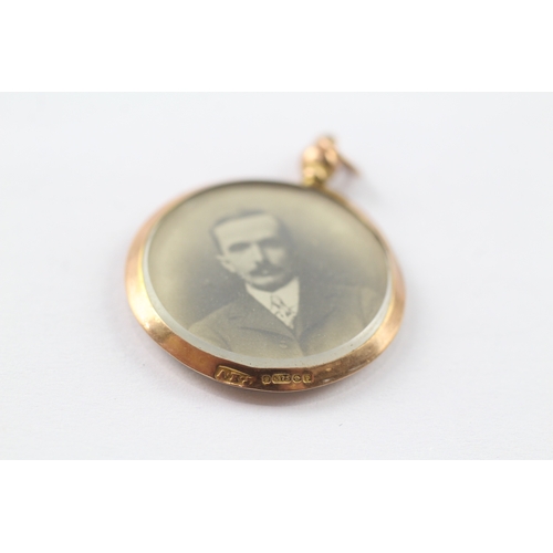 242 - 9ct gold antique double sided locket with photographs (4.5g)