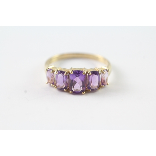 50 - 9ct gold graduated amethyst five stone dress ring (2.2g) Size P