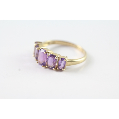 50 - 9ct gold graduated amethyst five stone dress ring (2.2g) Size P