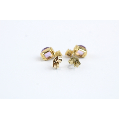 51 - 9ct gold amethyst and diamond stud earrings (2.3g)