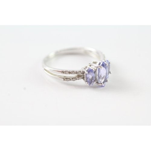 64 - 9ct white gold marquise cut tanzanite trilogy dress ring w/ diamond set shoulders (2.2g) Size N