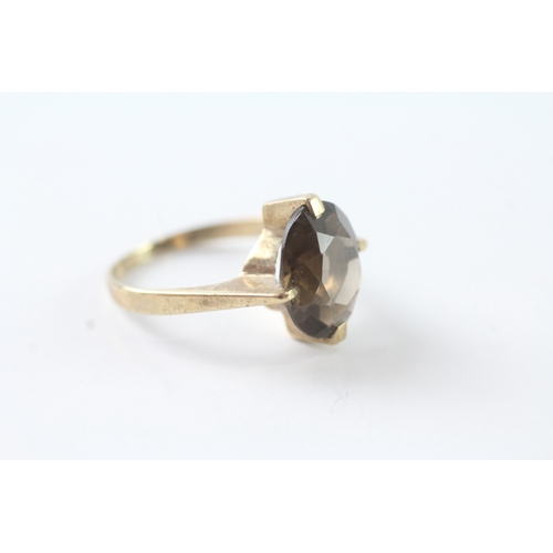 82 - 9ct gold oval cut smokey quartz solitaire dress ring (3.1g) Size M 1/2