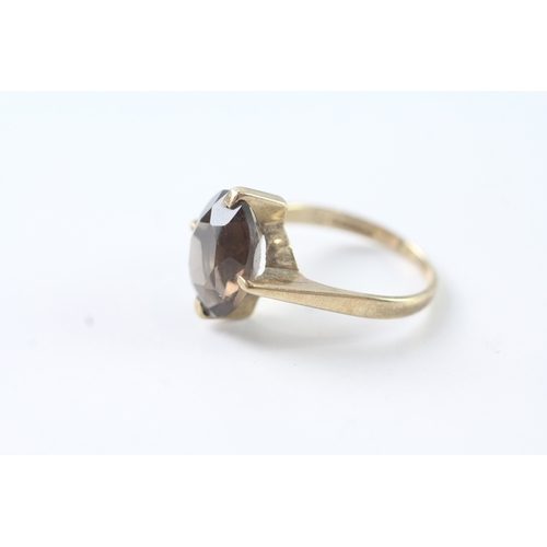 82 - 9ct gold oval cut smokey quartz solitaire dress ring (3.1g) Size M 1/2