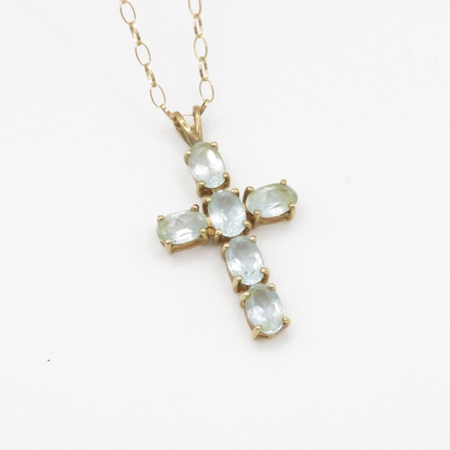 80 - 9ct gold blue topaz set cross pendant necklace (2.5g)