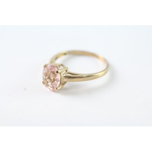 101 - 9ct gold oval cut pink gemstone solitaire dress ring (1.9g) Size N