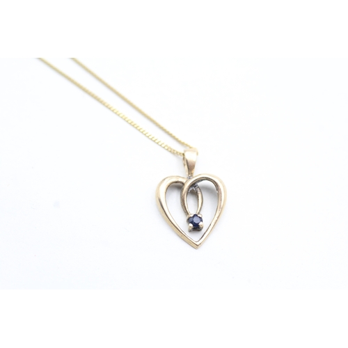 11 - 9ct gold sapphire set open heart pendant necklace (2.7g)