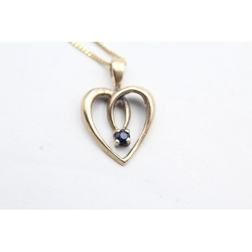 11 - 9ct gold sapphire set open heart pendant necklace (2.7g)