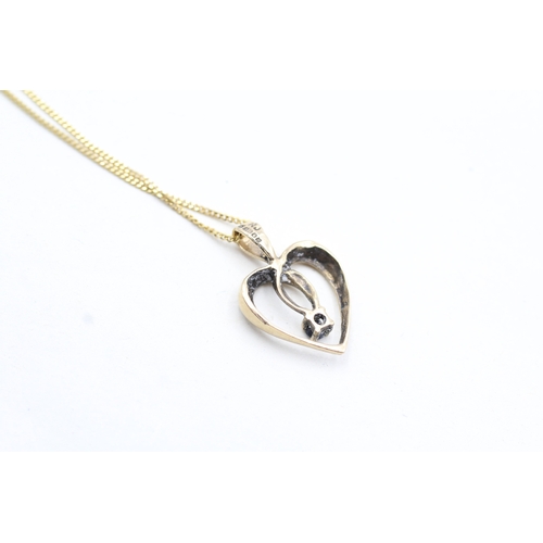 11 - 9ct gold sapphire set open heart pendant necklace (2.7g)