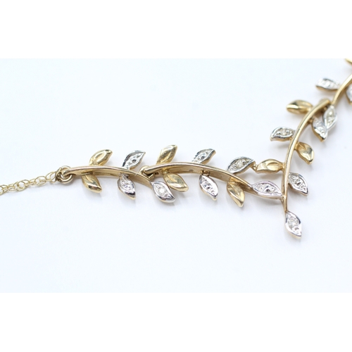 131 - 9ct white and yellow diamond vine branch necklace (2.8g)