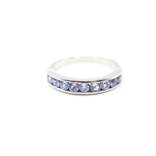 143 - 9ct white gold tanzanite half eternity ring (3.7g) Size R