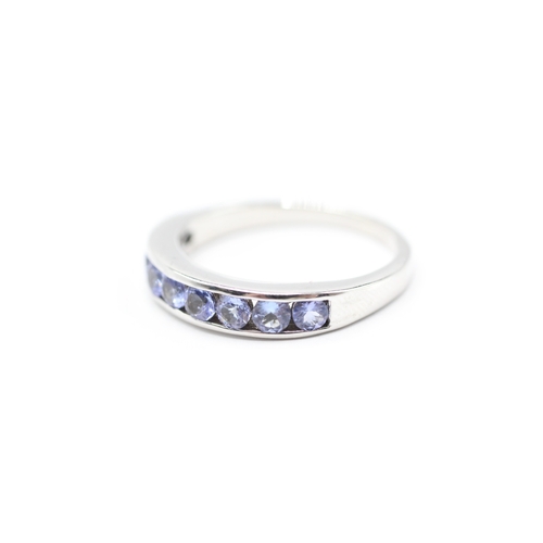 143 - 9ct white gold tanzanite half eternity ring (3.7g) Size R