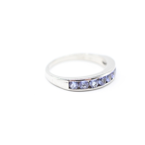 143 - 9ct white gold tanzanite half eternity ring (3.7g) Size R