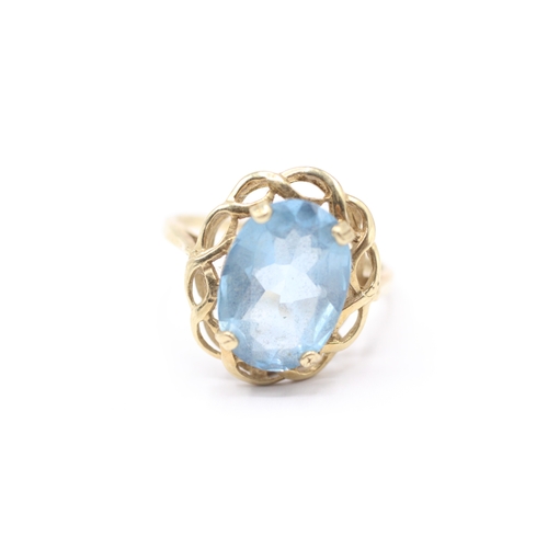 146 - 9ct gold blue gemstone cocktail ring (3.6g) Size Q 1/2