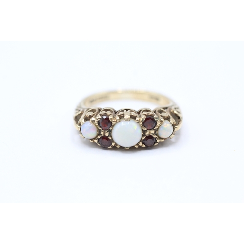 149 - 9ct gold vintage opal & garnet dress ring with a patterned gallery (3.5g) Size L