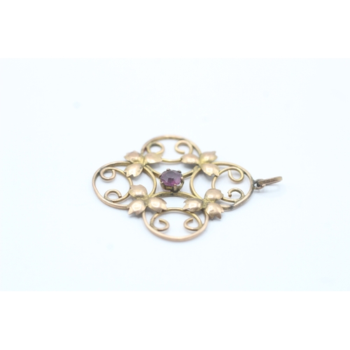 160 - 9ct gold Edwardian purple gemstone floral pendant (2g)