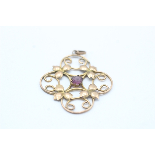 160 - 9ct gold Edwardian purple gemstone floral pendant (2g)