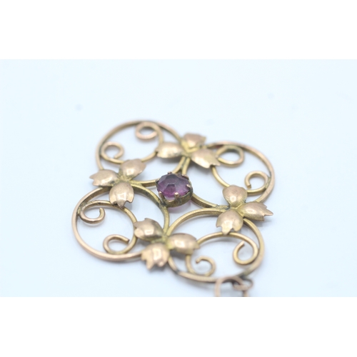 160 - 9ct gold Edwardian purple gemstone floral pendant (2g)