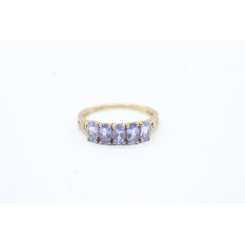 180 - 9ct gold oval cut tanzanite five stone ring (1.7g) Size M 1/2