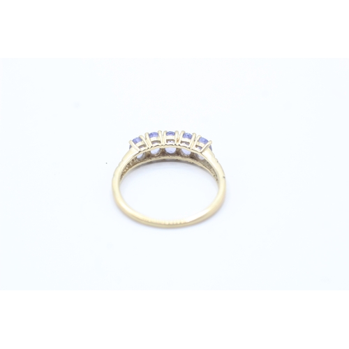 180 - 9ct gold oval cut tanzanite five stone ring (1.7g) Size M 1/2