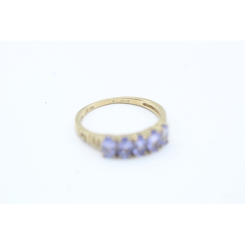 180 - 9ct gold oval cut tanzanite five stone ring (1.7g) Size M 1/2