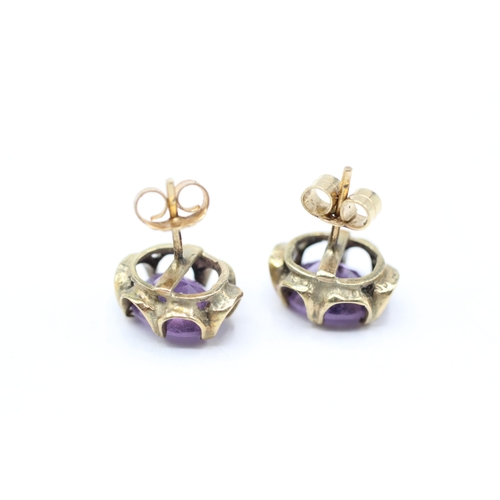 193 - 9ct gold amethyst stud earrings (2.7g)