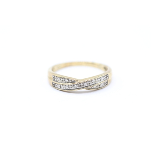 207 - 9ct gold diamond pave twist ring (1.9g) Size O